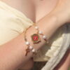 Pulsera de Perlas con Dijes